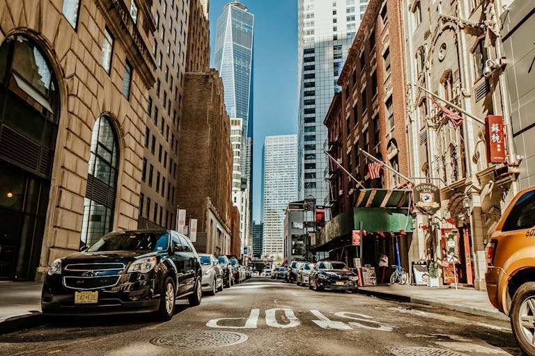 Dynamic street view of New York City with skyscrapers and urban life.